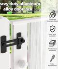 Heavy duty aluminum alloy barn door lock installed on outdoor gate, showcasing durable sliding latch for privacy and safety.