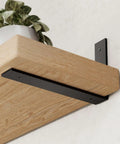 6 Pack Heavy Duty 12 Inch Black L Shelf Brackets For Floating Shelves 1/5 Inch Thick One Piece Stamped Construction with plant.