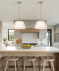 16" White and Gold Drum Pendant Light with Metal Lantern Fabric Shade hanging over a kitchen island with modern decor.
