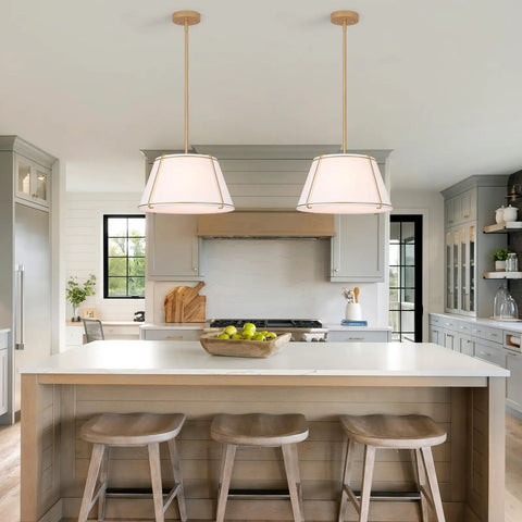 16" White and Gold Drum Pendant Light with Metal Lantern Fabric Shade hanging over a kitchen island with modern decor.