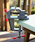 Compact Mini Hobby Vise For DIY Crafting And Jewelry Repair Handy Small Bench Clamp Multi Purpose Workbench Vise With Precision Gripping And Durable Steel Construction Ideal For Model Making Electronics And Repair Jobs mounted on a table