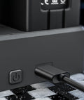 Close-up of power button and port on 3 In 1 Drone Battery Charger Hub For Phantom 4 Series With LED Display, Charges Three Batteries In A Row.