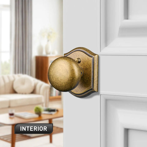 Privacy Door Knob For Interior Doors In Antique Brass installed on white door in living room setting