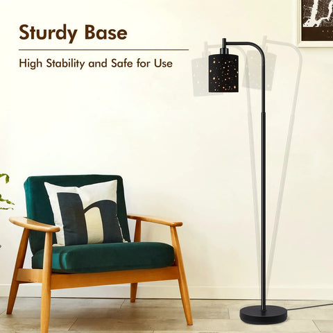 Industrial Floor Lamp With Adjustable Three Light Tree Stand shown next to a chair, highlighting its sturdy base.