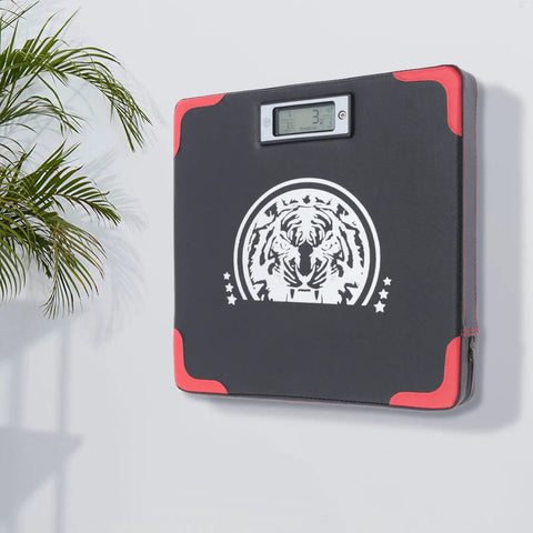 Rock Solid Wall Mounted Boxing Punch Force Tester Durable Multi Layer Striking Pad For Home Gym mounted on wall with digital display.