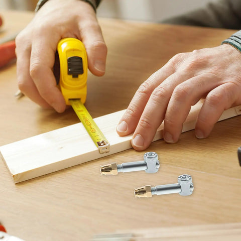Hands measuring wood with tape, Invisible Furniture Connector Nut Set 35mm Four Pack For Cabinet Fastening And Repair shown