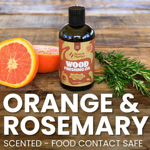 Straight Up Coconut Mct Wood Finishing Oil And Food Safe Cutting Board Sealer on wooden surface with orange and rosemary.