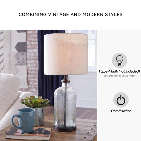 Modern Farmhouse Seeded Glass Table Lamp in Bronze Finish, 22.5 Inch Tall on a wooden table with books and a mug