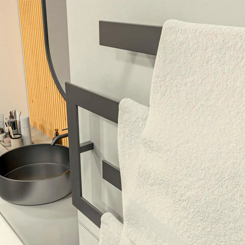 Modern Towel Shelf With Matt Black Finish Four Tier Wall Mounted Towel Rails And Shelves Rack in bathroom setting