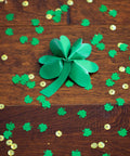 Green Heavy Duty Duct Tape Roll, Single Roll, shamrock craft on wooden floor, surrounded by green and gold confetti.