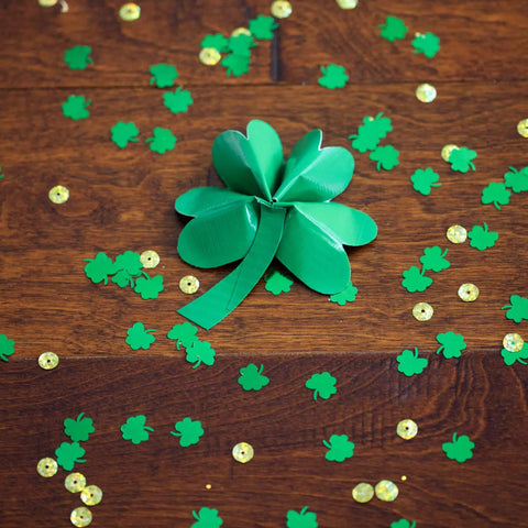 Green Heavy Duty Duct Tape Roll, Single Roll, shamrock craft on wooden floor, surrounded by green and gold confetti.