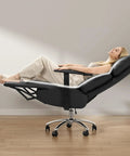 Woman reclining in Ergonomic Leather Office Chair With Adjustable Headrest And Footrest, 170 Degree Zero Gravity Recline For Home Office, Black