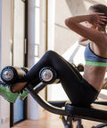 Person exercising on gym equipment, emphasizing the use of Gym Wipes for Equipment Cleaning Large 8x12 Inches 700 Count Refills.
