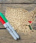 Wooden USA Map Wall Decor For Travel Buffs With All 50 State Abbreviations Engraved Ornament on rustic background with markers
