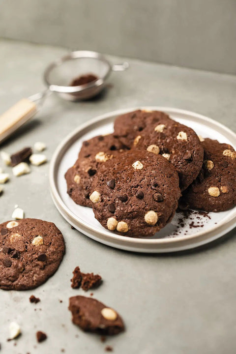 Plate of chocolate chip cookies baked on a Nonstick Silicone Baking Mat For Cookies, Pro Grade Quality With Fiberglass Mesh.
