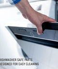 Hand opening dishwasher door, highlighting dishwasher safe parts for easy cleaning.