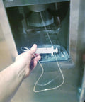 Water Line Defrost Tool For Refrigerator Ice Maker, Quick Defrost Dispenser Line Kit, 60 inch hose shown in use with fridge