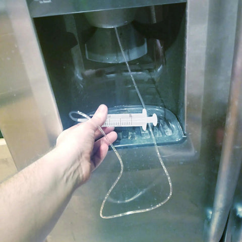 Water Line Defrost Tool For Refrigerator Ice Maker, Quick Defrost Dispenser Line Kit, 60 inch hose shown in use with fridge