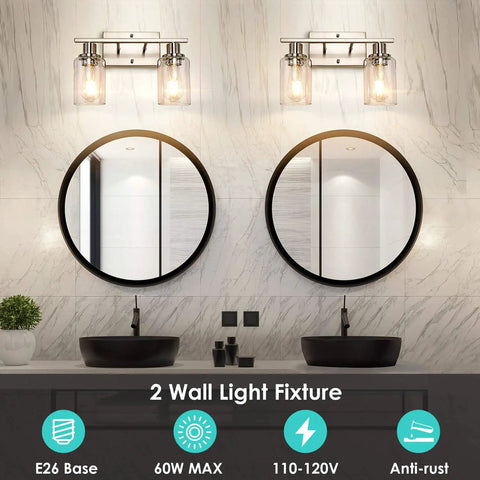 Modern Two Light Vanity Light Fixture In Brushed Nickel With Clear Glass Shades Over Mirror in Bathroom Setting