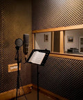 High Density Soundproof Foam Panels With Hella Strong Self Adhesive Backing For Zero Drama Home Studio Acoustic Dampening Treatment Tiles Full Surface Matte Black in vocal booth.