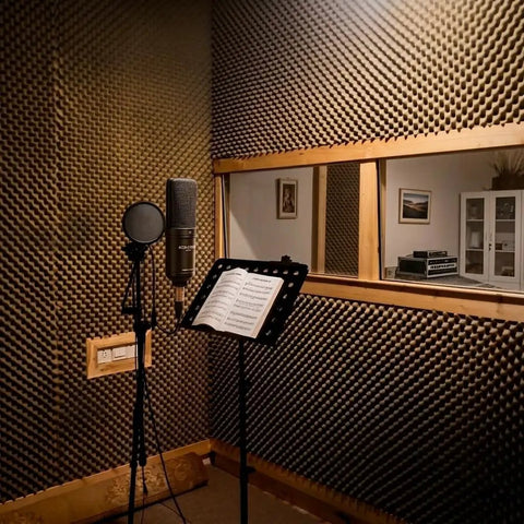 High Density Soundproof Foam Panels With Hella Strong Self Adhesive Backing For Zero Drama Home Studio Acoustic Dampening Treatment Tiles Full Surface Matte Black in vocal booth.