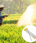 Person using Stainless Steel Garden Sprayer Extension Rod 17.7 Inch Replacement Wand for easy tall plant watering in a field