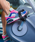 2 Pairs Universal Exercise Bike Pedal Straps For Home Gym Durable Rubber Straps Built Wider And Longer For Maximum Comfort On Any Ride Fits Up To 12.99 Inches Long And 2.24 Inches Wide shown on a stationary bike pedal with shoe