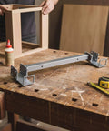 FytStycale Heavy Duty Adjustable Angle Corner Clamp For Carpentry Framing Jig, 16 To 24 Inches on a workbench with wood pieces.