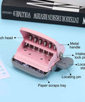 Six Hole Paper Punch One Quarter Inch Metal Hole Puncher for office and home, pink, showcases metal handle and locating pin.