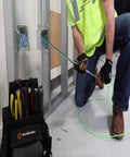 Electrician using THHN 10 AWG Copper Wire Red 100 Ft Roll Indoor Outdoor 600V Rated for power distribution installation