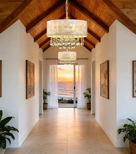 Showstopping Four Lights Drum Crystal Shade Black Chandelier Pendant Light in a bright hallway overlooking sunset