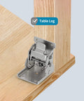 Close-up of Heavy Duty Folding Brackets For Table Legs And Wall Shelves With Self Locking Hinges installed on wooden table leg.