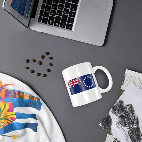 Flat lay of Cook Islands flag 11 oz ceramic mug on desk with laptop, coffee beans, and papers. Flag Of The Cook Islands Coffee Mugs 11 Oz Double Sided Print Mug With Handle Dishwasher Safe Premium Ceramic Awesome Gift For Home Office Coffee Lovers.