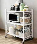 Nix The Clutter With This Game Changing Heavy Duty Folding Metal Organizer Shelf In Crisp White, three tier shelf with kitchen items.