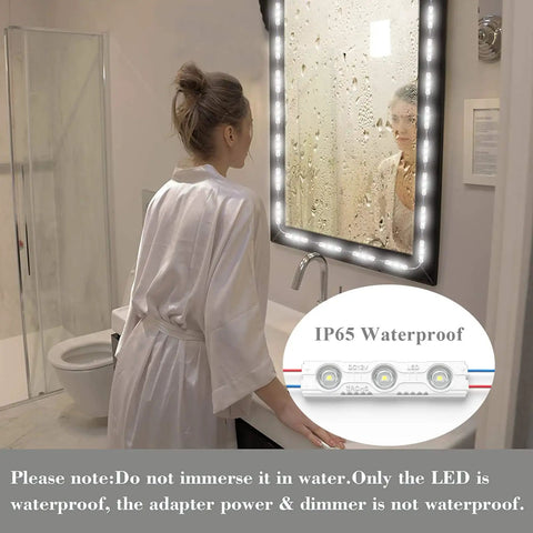 Person using LED Vanity Mirror Lights with RF Remote, Dimmable Hollywood Style 13ft LED Strip in bathroom setting