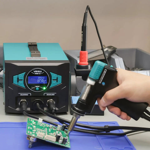 Person using Pro Grade 110W EVO Soldering Station And Desoldering Kit With Vacuum Pump on circuit board