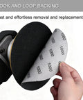 Close-up of 50 Pcs 5 Inch Hook And Loop Sanding Discs Set With 320 400 600 800 1000 Grit Pro Grade Wet Dry Sandpaper Assortment