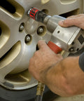 Using 14 Piece 1/2 Inch Drive Impact Socket Set With 10-24mm Deep Sockets on silver car wheel lug nut