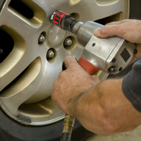 Using 14 Piece 1/2 Inch Drive Impact Socket Set With 10-24mm Deep Sockets on silver car wheel lug nut