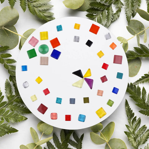 28 Piece Stepping Stone Mold Kit With Round Concrete Molds And Mosaic Tiles And Carving Tools For DIY Handprint And Footprint Stones For Gardens Beds And Walkways In Your Backyard, featuring colorful mosaic tiles on a white round board.