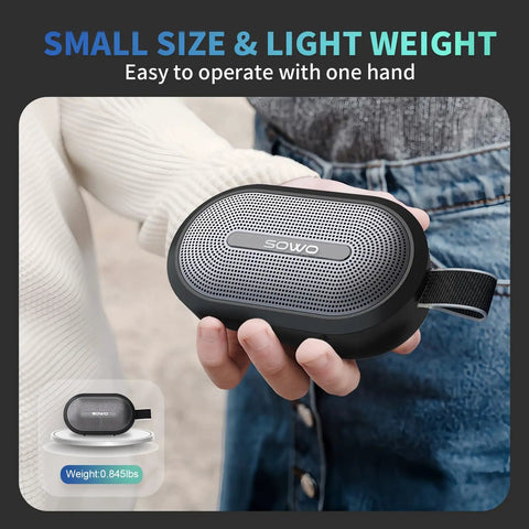 Wireless Portable Bluetooth Speaker With Deep Bass And Pro Sound IP67 Waterproof 24 Hour Playtime Magnetic Clip On Hang Design held in hand.