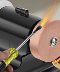 Widened Thickened Base Mini Bench Grinder With Permanent Magnetic Copper Motor Electric MultiPurpose Sharpening Machine Small Benchtop Knife Tool Grind Station Safe 3mm Metal Cover For Hobby And Pro showing a rotating copper wheel with sparks during sharpening.