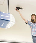 Woman installing MyQ WiFi Smart Garage Door Hub Lets You Open And Close Your Garage Door From Anywhere With Your Phone Real Time Alerts