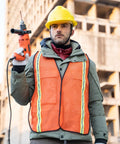 Man wearing Snap Up These Super Bright 10 Pack High Visibility Safety Vests With One Inch Reflective Strips holding a power tool.