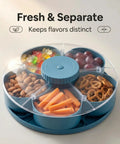 Rotating 5-Compartment Snack Tray With Lid containing almonds, carrots, grapes, pretzels, and candy, Lazy Susan style, blue.