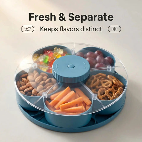 Rotating 5-Compartment Snack Tray With Lid containing almonds, carrots, grapes, pretzels, and candy, Lazy Susan style, blue.