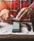 Person sharpening knife on Actual Grit Whetstone Set With 400 1000 3000 8000 Grits For Knife Sharpening Pro Grade Silicon Carbide Stone