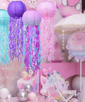 Jellyfish Paper Lanterns 6 Pack Hanging Lit Colorful Lanterns For Mermaid Unicorn Theme Classroom Decor Under The Sea Ocean Birthday Party Decorations For Undersea Parties Classroom Decor And Birthday Celebrations, featuring pink, purple, and teal jellyfish lanterns.