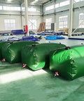 Collapsible Outdoor Water Storage Bag For Garden Farm And Livestock Use, Green PVC Water Bladder Tank, displayed in warehouse