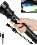 Hand holding Rechargeable LED Flashlight 99,000 Lumens Ultra Bright Handheld Torch With 5 Modes, USB-C, shown with charging cable